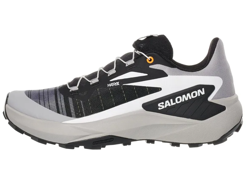 Salomon Genesis in Black/Alloy/Turmeric